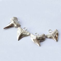 Exclusive deal alert! Shark Tooth Pendant | Silver Shark Tooth | Dainty Silver Charm | Surfer Charm | Shark Tooth Necklace | Fossil Shark Tooth | Sterling Silver, available for a limited time at the incredible price of $95.00
#StatementPendant #SilverSharkTooth #SterlingSilver #SurferCharm #SharkToothJewelry #SharkToothNecklace #SharkToothCharm #DaintySilverCharm #SharkToothPendant #FossilSharkTooth Marine Jewelry, Shark Tooth Pendant, Long Stone Necklace, Silver Shark, Tooth Pendant, Shark Tooth Necklace, Tooth Necklace, Ocean Jewelry, Shark Tooth