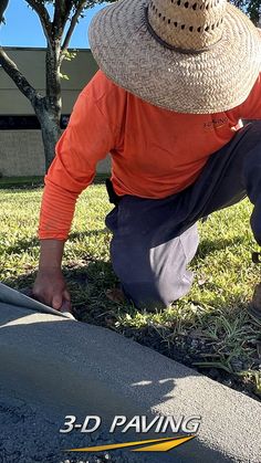 Concrete contractor wearing a straw hat puts the final touches on a freshly poured concrete curb using a hand trowel. 3-D Paving and Sealcoating in South Florida. Concrete Curbing, Concrete Slab, Coral