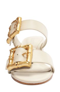 Bamboo-textured buckles bring eye-catching detail to a double-band slide sandal kicked up on a block heel. 2 1/2" heel (size 8.5) Leather upper/synthetic lining and sole Made in Brazil Open Toe Slides With Gold Buckle For Spring, Summer Block Heel Mules With Buckle Closure, Spring Open Toe Slides With Gold Buckle, Spring Slides With Gold Buckle And Open Toe, Summer Leather Slides With Gold Buckle, Open Toe Sandals With Gold Buckle For Summer, Summer Open Toe Sandals With Gold Buckle, Synthetic Open Toe Sandals With Tang Buckle, Elegant Mules With Buckle Closure In Slide Style