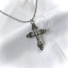 This silver Gothic cross necklace features a vintage grunge design, making it an ideal gift for her, especially for women who appreciate religious jewelry, Catholic gifts, or cross charm necklaces. 𝐃𝐄𝐓𝐀𝐈𝐋𝐒:  ⭐️ Necklace lengths available 14" 16" 18" 20" ⭐️ Silver Cross Pendant size is 2" ⭐️ The silver cross charm is silver plated over alloy. The chain necklace is made up of high qualitystainless steel, safe for those with sensitive skin ⭐️ The best statement necklace, The Silver Celestial Vintage Sterling Silver Cross Pendant Necklace, Vintage Sterling Silver Cross Necklace Gift, Vintage Nickel-free Cross Necklace, Vintage Crucifix Cross Necklace As Gift, Vintage Crucifix Cross Necklace Gift, Vintage Antique Silver Cross Necklace, Vintage Cross Necklace As Gift, Antique Silver Cross Pendant Necklace For Gift, Vintage Silver Cross Necklace