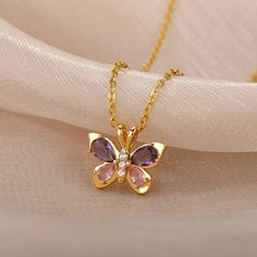 This cute butterfly necklace symbolizes beauty, love, and hope! Perfect gift for yourself or any of your loved ones. ✦ WHY YOU'LL LOVE IT: 🪙 Gold/platinum necklace ✨ Symbolizes powerful emotions/traits 🎁 Unique gift idea ✦ PRODUCT DETAILS: * Pendant Size: 2 Centimeters // 0.8 Inches * Chain Length: 45 Centimeters // 18 Inches * All our work is custom-made by hand with love 💖 ✦ FREE SHIPPING + 15% OFF (4-9 Days) --- Do you love this item and want to buy it later? Just click on the heart-shaped icon to your right to add it to your favorites. If you have any questions or special requests just send me a message and I will gladly help you. ✦ Thank you for shopping small and supporting my dream! Butterfly Pendant Necklace For Mother's Day, Butterfly Charm Necklace For Mother's Day Anniversary, Butterfly Charm Necklace For Anniversary And Mother's Day, Mother's Day Butterfly Pendant Necklace, Mother's Day Butterfly Charm Pendant Necklace, Anniversary Butterfly Charm Necklace For Mother's Day, Mother's Day Anniversary Necklace With Butterfly Charm, Elegant Pink Butterfly Necklace Gift, Elegant Pink Butterfly Necklace For Gift