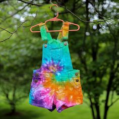 | Tie Dye Girl's Overall Shorts | ❤️ These vibrant little overalls are perfect for sunshiney spring and summer days! The material is incredibly soft, stretchy and durable for all the activities your little hippie will be doing. These overalls come in several different fabulous colors, but can also be ordered in custom colors, if you would like to design your own. Please check out our adult overall shorts in the link below to order a matching mommy & me set: https://www.etsy.com/listing/69416 Summer Cotton Overalls For Playwear, Summer Cotton Overalls For Playdate, Cotton Shortalls For Playwear In Spring, Multicolor Cotton Overalls For Summer, Playful Spring Overalls For Playwear, Playful Cotton Shortalls, Multicolor Bottoms For Playtime In Summer, Multicolor Bottoms For Summer Playtime, Multicolor Summer Bottoms For Playtime