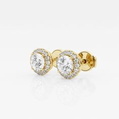 Enhance your everyday studs with these halo diamond stud earings. Each large round lab grown diamond is encircled with enchanting smaller diamonds to create a halo effect. Luxury Gold Halo Design Earrings, Luxury Gold Halo Design Cluster Earrings, Timeless Round Diamond Earrings With Halo Setting, Halo Diamond Earrings With Round Cut, Diamond Halo Earrings With Round Cut, Lab Grown Diamond Halo Earrings For Anniversary, Timeless Round Cut Halo Diamond Earrings, Halo Round Cut Diamond Earrings, Halo Diamond Earrings Round Cut