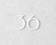 the number sixty is made out of white paper