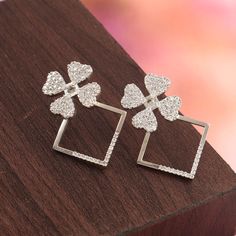 CZ silver floral earring. Gift for her. 925 solid sterling silver earring. CZ diamond flower earring Metal - 925 Sterling Silver Product Type - Silver earrings Main stone - Cubic Zirconia Stone Dimension - 1.50 MM, 1.80 MM Stone Shape - Round Total Weight -  6.50 Grams Approx. (2 piece) We can also make this jewelery in Gold, White Gold and Rose Gold as per customer's request. **CUSTOMER SERVICE** Our First Priority is Customer Satisfaction and Happiness. I gladly accept CUSTOM ORDER If any, DM Me freely. If Any Query About The Product , Contact Me Anytime, Always Here For Your Solutions. Shipping Policy :-  *Shipping Thru FedEx, DHL Express, USPS & Other Courier Services.  * We ship item(s) from India to Worldwide Within 3-5 business days after the payment has been cleared.  * We use USPS Silver Cubic Zirconia Flower-shaped Earrings, Dazzling Cubic Zirconia Flower Shaped Earrings, Cubic Zirconia Jewelry With Matching Flower Shaped Earrings, Flower Shaped Cubic Zirconia Jewelry With Matching Earrings, Silver Flower Earrings With Diamond Accents, Silver Diamond Earrings With Flower Accents, Silver Diamond Earrings With Floral Accents, Diamond White Flower-shaped Diamond Earrings As Gift, Sparkling Cubic Zirconia Flower Earrings