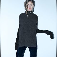 Ribbed Poncho Ribbed Knit Poncho With High Collar . Anthracite Color: Grey Outer Shell 43% Acrylic 28% Polyester 24% Polyamide 5% Wool New With Oversized Ribbed Winter Outerwear, Cashmere Turtleneck Outerwear For Layering, Funnel Neck Cashmere Outerwear For Fall, Fall Cashmere Outerwear With Funnel Neck, Winter Cashmere Knit Outerwear, Fall Cashmere Funnel Neck Outerwear, Winter Chunky Knit Tops For Work, Chunky Knit Top For Winter Workwear, Cashmere Turtleneck Outerwear For Winter