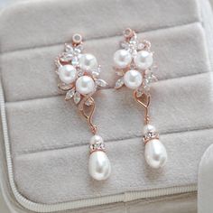 Long Rose gold Pearl drop Bridal earrings - MIA - Treasures by Agnes Rose Gold Pearl Drop Flower Earrings, Rose Gold Flower Drop Earrings With Pearl, Rose Gold Drop Earrings With Pearl Detail For Bridal, Rose Gold Bridal Drop Earrings With Pearl, Rose Gold Pearl Drop Dangle Earrings, Rose Gold Dangle Pearl Earrings, Rose Gold Dangle Earrings With Pearl Charm, Pearl Drop Bridal Earrings, Drop Bridal Earrings