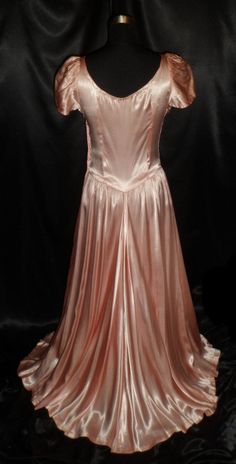 "This truly elegant gown is in Great to Excellent condition. It has a beautiful heavily ruched bodice with a basque waist. It has a side hidden metal zipper and on the back of the zipper are patent numbers that date 1929, so this could possibly be a late 20's dress/gown. It is much more gorgeous than the picture can show, a phenomenal find, I may not come across another one like this for a long time, you had best buy it right away! Bust/Chest - 36\", Waist - 28\", Hips - 38\", Length - 55\", Swe Vintage Wedding Dress With Ruched Bodice, Full Length Evening Dress With Fitted Bodice, Full Length Ruched Evening Dress, Formal Full-length Gown With Corset Back, Full Length Gown With Corset Back And Fitted Bodice, Fitted Full Length Gown With Corset Back, Victorian Fitted Dress For Debutante Ball, Vintage Dresses For Debutante Ball, Full-length Gown With Lined Fitted Bodice