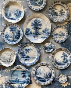 blue and white plates with trees on them