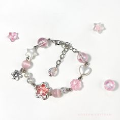 Flower beaded friendship bracelet Trendy Silver Flower Bracelets, Cute Pink Beaded Bracelet With Flower Charm, Trendy Flower Bracelets For Friendship, Trendy Pink Beaded Chain Bracelet, Trendy Pink Beaded Chain Bracelets, Pink Round Beads Friendship Bracelets For Spring, Trendy Pink Flower Friendship Bracelets, Adjustable Beaded Friendship Bracelets, Pink Flower Charm Jewelry For Friendship