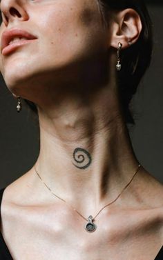 a woman with a tattoo on her neck