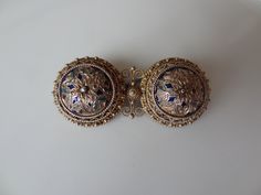 Traditional Norwegian (Solje) wedding brooch by David Andersen, Oslo, made 1888-1925. In the shape of two Viking shields, very delicately crafted, completely gold-plated and partly cloisonne enamelled. Stamped on the back with the David Andersen hallmark and 830 pp. Width 4.5 cm, 1.8 inches, depth 2 cm, 0.8 " and height approximately 1 cm Condition: partial loss of enamel Viking Shields, Viking Shield, Wedding Brooch, The David, Cloisonne Enamel, Oslo, Vikings, Brooch Pin, Brooches