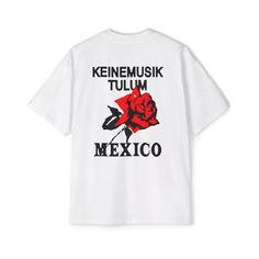 Introducing the Keinemusik Techno T-shirt, a must-have for any music enthusiast. Crafted with care, this standout piece features the renowned "Keinemusik" motif and the captivating "Mexico Rose" design. Made from high-quality, breathable cotton fabric, it ensures comfort while keeping you stylish. Available in a versatile white color, this t-shirt pairs effortlessly with any streetwear ensemble, making it a staple in your wardrobe. Designed for aficionados of house music and techno, this Keinemu Relaxed Fit T-shirt With Text Print For Music Festivals, Relaxed Fit Graphic T-shirt For Concerts, Band Merch Graphic T-shirt For Music Festival, Music-themed White Tops With Letter Print, Urban Style Concert T-shirt With Screen Print, Band Logo T-shirt For Concerts, Relaxed Fit, Band Logo T-shirt For Concerts With Relaxed Fit, Casual Slogan T-shirt For Concert, Band Merch Relaxed Fit T-shirt For Concerts