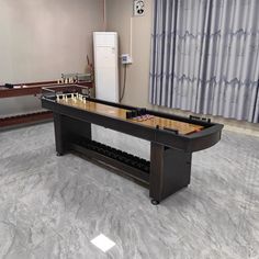 a foo - pong table sits in the middle of a room