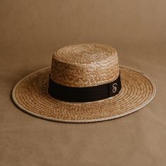 "Looking for a stylish and functional summer accessory? Look no further than this women's straw boater hat. Crafted from high-quality materials using traditional Mexican weaving techniques, this wide-brimmed hat offers a perfect combination of luxury and practicality. Its sturdy construction provides ample protection from the sun's rays, while the airy design keeps you cool and comfortable all day long. With its elegant boater crown and light, natural color, this hat is a must-have for any fashion-conscious woman. And, with the addition of the sleek black Sandoval strap, it's sure to turn heads wherever you go. Upgrade your summer wardrobe with this exclusive and charming hat today. SIZE: MEDIUM Medium (M) = head circumference of 56 - 58.5cm HOW DO I KNOW MY SIZE Discover your size with a Spring Adjustable Top Hat With Flat Crown, Spring Adjustable Flat Crown Top Hat, Classic Boater Hat With Curved Brim For Spring, Classic Wide Brim Top Hat For Spring, Classic Brimmed Boater Hat For Spring, Fitted Brimmed Boater Hat For The Beach, Fitted Wide Brim Boater Hat For Beach, Elegant Spring Sun Hat With Flat Crown, Elegant Top Hat With Flat Crown For Summer