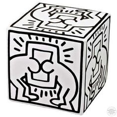 a black and white drawing of a cube with an image of a lion on it