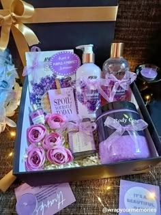 an open gift box with soaps, body lotion and hand sanitizers