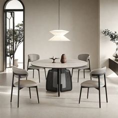 a dining table with four chairs around it