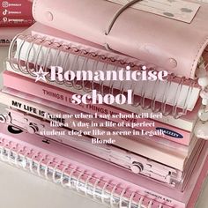 a stack of books with the words romanticise school written on them in white and pink