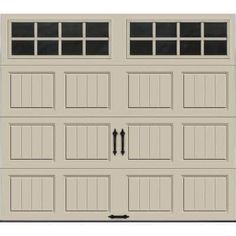 a white garage door with windows on the top and bottom panel, in front of a white background