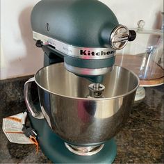 a kitchen mixer sitting on top of a counter