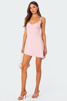 Mini dress Open back Asymmetric hem Lace bow detailing Polyester, Spandex Model wears size S Model height is 5'9 Item care: Wash with similar color Open Back Mini Dress, Dress Open Back, Swimwear Dress, Lace Bows, Pink Mini Dresses, Cute Bows, Cropped Tank Top, Asymmetric Hem, S Models