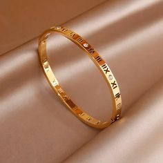 41136156082199 Gold Stainless Steel Bangle Bracelet, Gold Stainless Steel Jewelry With Bracelet Strap, Gold Alloy Bangle Bracelet, Dainty Gold Alloy Bracelet, Gold Alloy Bracelets For Party, Gold Alloy Party Bracelets, Adjustable Gold Alloy Bracelets, Gold-colored Stainless Steel Wedding Bracelet, Gold Metal Bangle For Anniversary