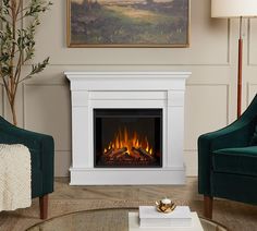 a living room with two chairs and a fire place in the middle of the room