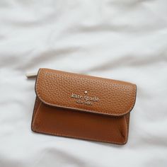 New Kate Spade Dumpling Pebbled Leather Small Card Holder Warm Ginger Ka574 $139 Size 3.28"H X 5"W Materials Pebbled Leather 100% Leather Details Metal Pinmount With Spade 2 Way Spade Jacquard Zip Pocket On Back Snap Closure Style # Ka574 Chic Leather Wallet With Coin Pocket, Chic Leather Bifold Wallet, Kate Spade Leather Wallet With Card Slots, Kate Spade Leather Wallets With Card Slots, Versatile Leather Coin Purse, Chic Leather Wallets With Card Slots, Kate Spade Leather Wallets For Everyday Use, Chic Leather Coin Purse With Card Slots, Leather Coin Purse For Everyday Use