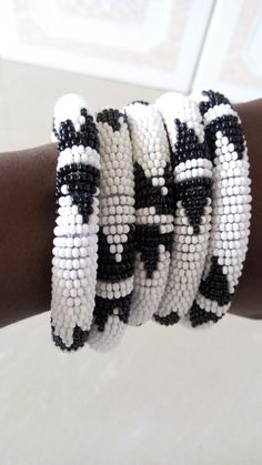 Bracelets | Custom Bracelets | Mother's Gift | Gift Idea | Bangles | Unique Gift | Bracelets For Women | Yoga Bracelets | Daughters Gift These superbly crafted Zulu beaded bracelets are made of fine beads which can be worn in any occasion.Color - White and black.Feel free to send me a convo or e-mail for any clarification.Thank you for visiting... Adjustable Beaded White Bangle, White Beaded Bangle With Round Beads, Adjustable White Beaded Bangle, Hand Wrapped White Beaded Bracelets, White Beaded Bangle Bracelets, Traditional White Stretch Bracelet With Round Beads, White Bracelets With Round Black Beads, Traditional White Round Beads Stretch Bracelet, White Bracelets With Black Beads