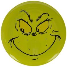 a yellow frisbee with an angry face drawn on it