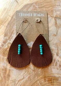 Handmade brown leather turquoise beaded earrings with cut fringe detail. Very lightweight. Artisan Brown Jewelry With Tassels, Bohemian Turquoise Leather Earrings, Brown Fringe Dangle Jewelry, Adjustable Southwestern Brown Earrings, Southwestern Brown Fringe Jewelry, Festival Brown Beaded Earrings With Tassels, Adjustable Brown Earrings With Beaded Fringe, Brown Beaded Fringe Earrings For Festival, Festival Brown Beaded Tassel Earrings