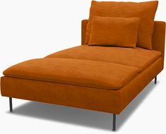 an orange chaise lounge with two pillows on it's back and one arm