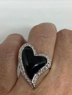 Vintage black onyx white sapphire ring 925 Sterling Silver Setting Size 6 Can be resized, my jeweler charges $10-$20 All rings are shipped free in the US in a nice gift box. Check out our over a THOUSAND great reviews Engraving is $4 per letter and is not always perfect depending on the piece. It can take a few days if the jeweler is busy. This is payable to Paypal Judithsltd@gmail.com Black Ring For Valentine's Day Formal Occasion, Black Rings For Valentine's Day Formal Occasion, Black Rings For Valentine's Day Formal Events, Black Diamond Jewelry For Valentine's Day, Valentine's Day Black Diamond Jewelry, Elegant Black Heart Cut Rings, Elegant Black Rings For Valentine's Day, Black Enamel Diamond Ring Perfect As A Gift, Diamond Rings With Black Enamel For Gift