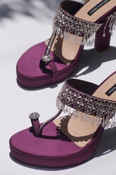 Purple heels with stones, beads embellishments on the strap, heels and toe ring.
Composition: Satin
Color: Purple
Other Details: 
Tassel detailing
Heel height (in inches): 4.75
Weight (in grms): 800 - Aza Fashions Glamorous Party Heels For Festive Occasions, Luxury Embellished Heels For Reception, Luxury Rhinestones Heels For Reception, Hand Embellished Heels For Party, Embellished Heels For Reception, Purple Heels Wedding, Ring Composition, Motorcycle Festival, Heels Purple