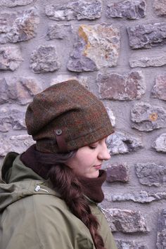 "l love this hat! I designed this hat with a more modern slouchy shape, using the exquisite Harris Tweed which I love to work with in the Autumn and Winter. It is so comfortable and warm as it covers the ears on those cold days. Harris Tweed is hand-woven by islanders in their homes in the Outer Hebrides and is made from pure virgin wool dyed and spun in the Outer Hebrides. This is what entitles it to carry the famous Orb Mark certifying it as Harris Tweed. lined with organic bamboo jersey which Slouchy Beanie For Outdoor, Outdoor Slouchy Beanie Hat, Slouchy Beanie For Outdoor Fall Activities, Slouchy Beanie For Outdoor Fall Events, Cozy Slouchy Hat For Outdoor Use, Warm Slouchy Hats For Fall, Slouchy Warm Hats For Fall, Slouchy Outdoor Fall Hat, Wool Beanie For Fall