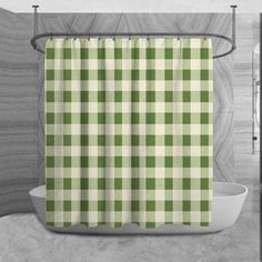 a green and white checkered shower curtain hanging on a bathroom wall next to a bathtub