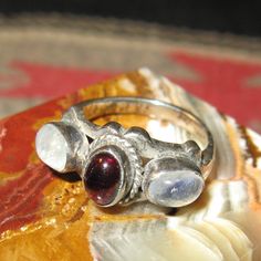 Sterling Cabochon Garnet & Blue Flash Moonstone Ring, Size 6, 6 grams. Spiritual Multi-stone Moonstone Ring, Garnet Ring Silver, Three Necklaces, Tacoma Wa, Garnet Ring, Fantasy Jewelry, Garnet Rings, Moonstone Ring, Ring Silver