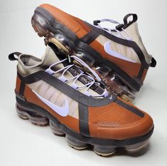 Elevate your sneaker game with these Nike Air VaporMax 2019 Utility in brown color. Designed for women, these sneakers feature a low top shoe shaft style with W shoe width to provide ultimate comfort while walking or running. The shoes are available in UK shoe size 6, US shoe size 8.5, and EU shoe size 40. Crafted with high-quality materials, these Nike Air VaporMax 2019 sneakers are perfect for athletic activities like running, jogging, and gym workouts. The product line includes Nike Air Vapor Nike Air Vapormax 2019, Vapormax 2019, Air Vapormax, Sneaker Games, Nike Air Vapormax, Top Shoes, Low Top, Brown Color, Gym Workouts