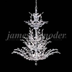 a crystal chandelier hanging from the ceiling in front of a black background,