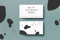 two business cards with black and white designs