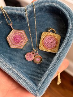 This exquisite bite-sized 'mini' locket necklace in pink sapphire pavé, a deliciously decadent keepsake to hold a treasured photo or a small token of affection. Just like with classic Devon Woodhill lockets, it opens to reveal a small compartment, providing a safe and secure place to hold a cherished photo or a tiny memento. Its compact size and delicate chain make it a versatile accessory, perfect for everyday wear or to be layered with other necklaces for a personalized look. Keepsake Diamond Pendant Jewelry, Diamond Pendant Jewelry For Keepsake, Luxury Rectangular Pendant Jewelry For Wedding, Luxury Rectangular Pendant Wedding Jewelry, Pink Gold Pendant Jewelry With Charms, Diamond Pendant Necklace For Keepsake, Cubic Zirconia Medallion Necklace Gift, Luxury Keepsake Round Pendant Jewelry, White Gold Jewelry With Detachable Pendant For Gift