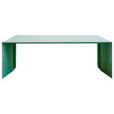 a glass table with green legs on a white background