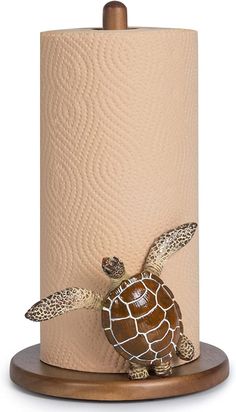 a toilet paper holder with a turtle on it