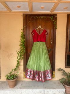 paithani lehenga set  |womens lavender red Kota silk  lehenga choli |crop top lehenga set |designer paithani lehenga dupatta | lavender wedding lehenga choli |green zari Kota wedding lightweight lehenga usa Women's lehenga set /zari Kota paithani embroidered lehenga skirt/voggish      lehengas are one of the beautiful and versatile traditional attires of india !! we carry such pieces in budget with great quality that can be styled in multiple ways with different outfits !!       Here is Beautiful light green zari Kota silk paithani border lehenga paired with contrast mix and match red pure raw silk hand embroidered V neck layered sleeve crop top as shown!! This set does not comes with dupatta but can be purchased separately  !! Skirt has heavy gear and both pieces can be mix and matched wi Fitted Green Lehenga In Art Silk, Green Fitted Lehenga In Art Silk, Fitted Green Art Silk Lehenga, Fitted Green Dola Silk Lehenga, Fitted Green Dola Silk Choli, Fitted Green Art Silk Choli, Fitted Green Chanderi Choli, Festive Anarkali Dress With Flared Skirt, Anarkali Skirt With Resham Embroidery