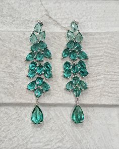 Silver green water dro crystal chandelier earrings, long silver green Swarovski crystal drop earrings, long dangle silver crystal earrings When you need that little something to finish of an outfit, these beautifully handmade and handcrafted earrings will do that.  These sophisticated earrings with semi-precious crystals will emphasise your outfit whether you want it to look simple or totally unique.  Simple with an elegant and sophisticated finish to complete the look.  Description:  * Green / Crystal Drop Chandelier Earrings With Sparkling Stones, Crystal Long Drop Chandelier Earrings As Gift, Sparkling Long Drop Crystal Earrings, Crystal Teardrop Earrings For Party, Crystal Linear Long Drop Earrings For Party, Silver Long Drop Chandelier Earrings With Sparkling Stones, Green Drop Earrings For Party, Green Linear Earrings For Parties, Glamorous Sterling Silver Dangle Chandelier Earrings