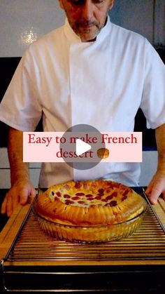 a man in white shirt standing next to a pizza on top of a grill with the words easy to make french dessert