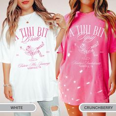 two women wearing matching t - shirts, one in pink and the other in white