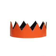 Orange Vegan Leather Crown. Black Satin Interior. Velcro adjustable strap in the back allows for different head sizes and hair styles. The perfect accessory to make a fashion statement and stand out in a crowd. Also perfect for special occasions ( Halloween, Birthday, Bachelorette, New Years Parties). Measurements : Adjustable up to 25 inches in circumference. 3 inches in height. Pumpkin Crown, Leather Crown, Pumpkin Queen, Glitter Crown, Satin Noir, Black Orchid, Costume Hats, Orange Leather, Purple Glitter