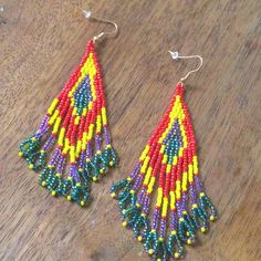 Gorgeous Beaded Fringe/Tassel Statement Earrings! Brand New Boutique Item In Original Packaging. Colorful Yellow And Red Beads With Iridescent Purple And Green Accents. So Beautiful And Fun! Hook Earrings. Hardware Is Bronze Toned. Approximate Measurements Length From Center Of Hook 4” Width At Widest 1.5” Tags Anthropologie Urban Outfitters Free People Zara Lucky Brand Madewell J. Crew Boho Tribal Festival Fringe Colorful Gypsy Tapestry Yellow Beaded Fringe Earrings With Round Beads, Traditional Yellow Beaded Earrings, Multicolor Fringe Beaded Earrings With Round Beads, Yellow Fringe Beaded Earrings With Round Beads, Yellow Beaded Earrings With Fringe, Traditional Multicolor Beaded Fringe Tassel Earrings, Traditional Yellow Beaded Earrings With Dangling Beads, Traditional Multicolor Beaded Tassel Earrings, Red Beaded Earrings With Colorful Beads For Festivals